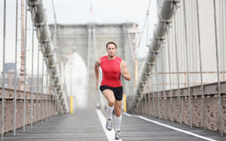 man running fast alone over a bridge