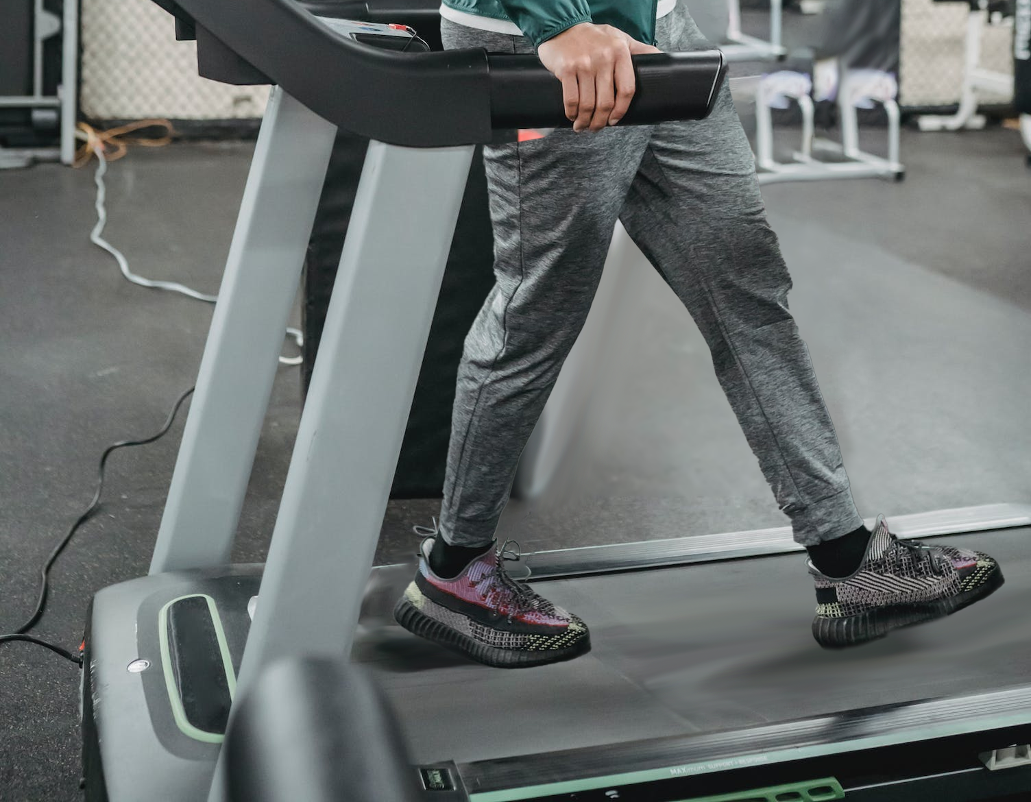 person reverse walking in the treadmill